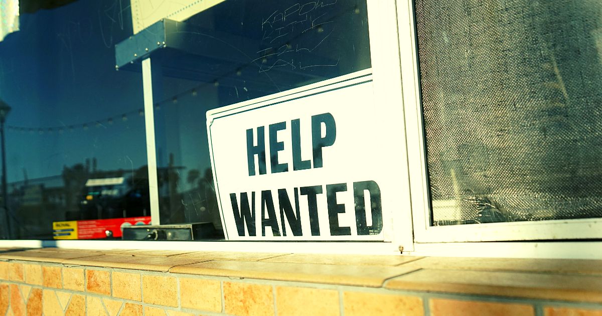 help wanted sign in shop or dealership window