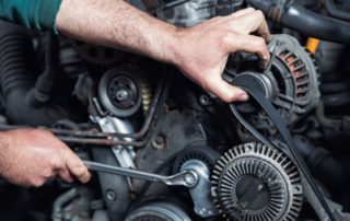 Mechanic with a wrench working on equipment