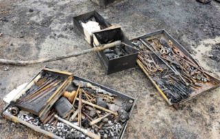 remains of tools after a shop fire