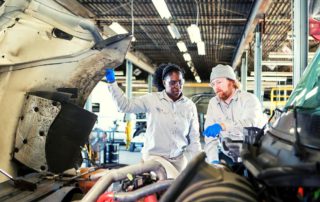 two technicians working on a truck