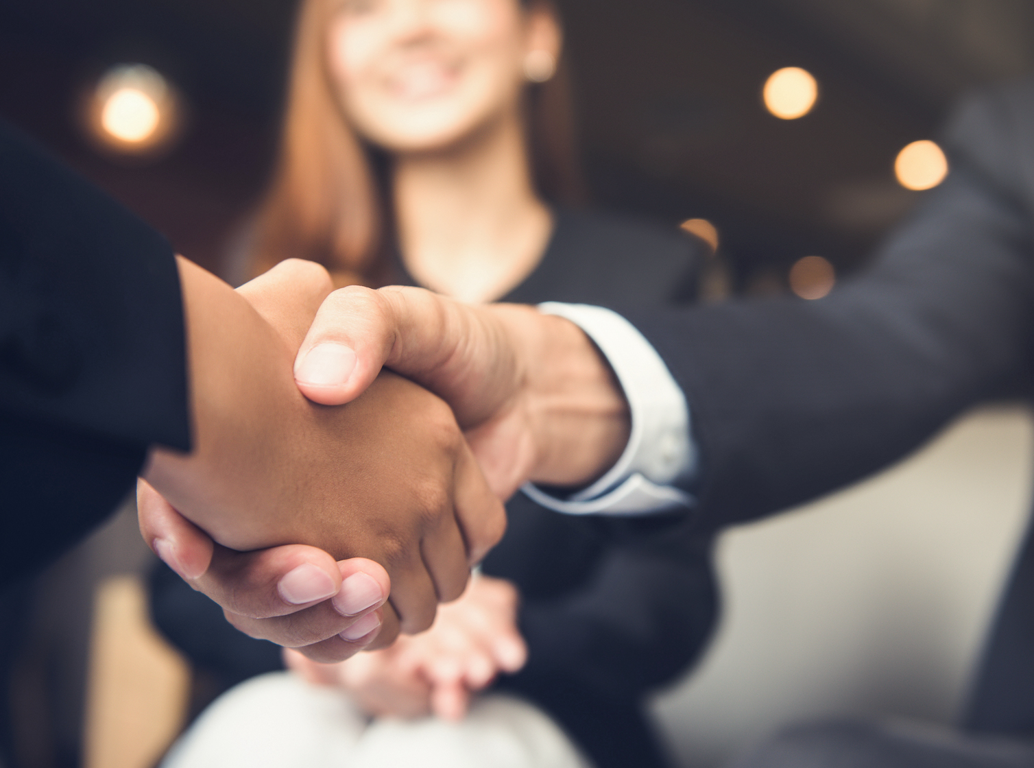 Two people shaking hands in partnership