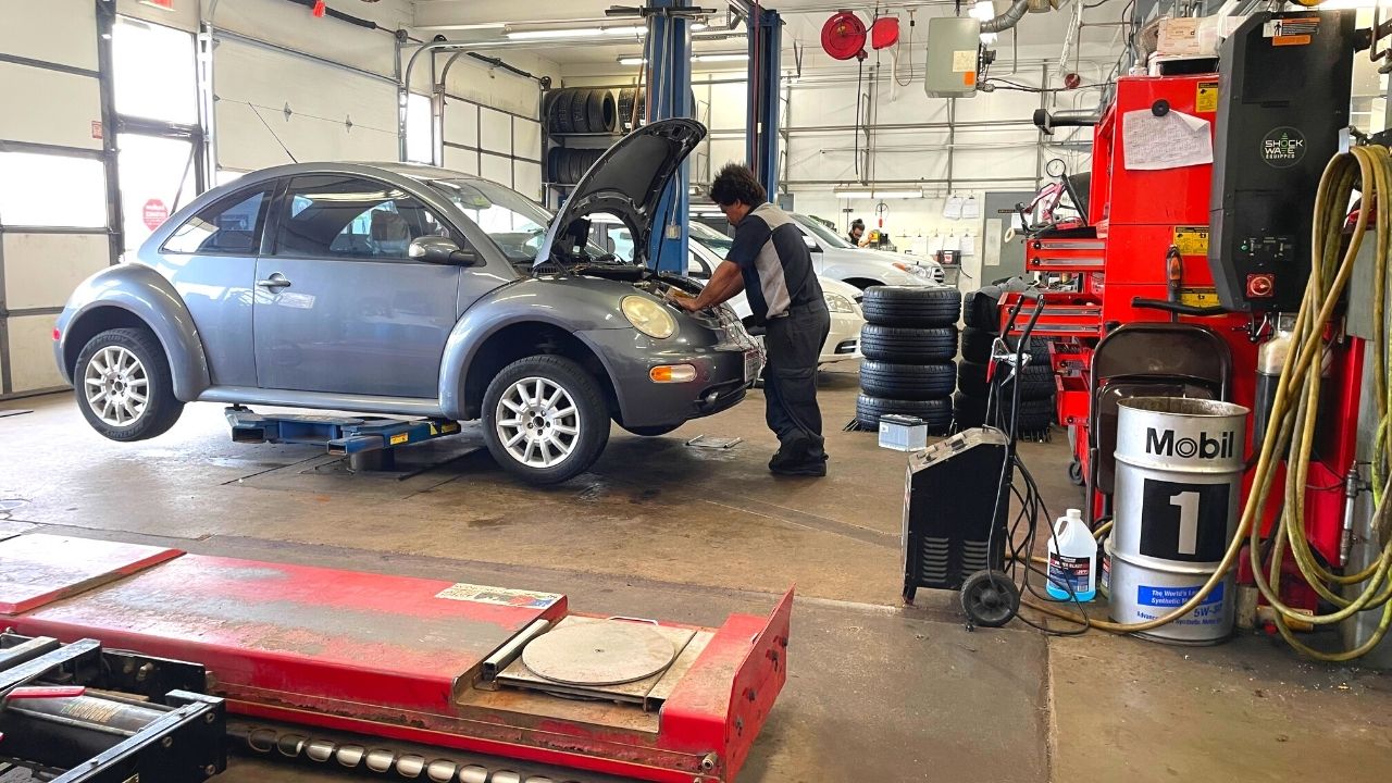 Technician working on a car at Monona Tire in Madison, Wisconsin