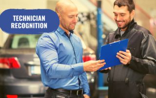 manager recognizing a technician in a repair shop