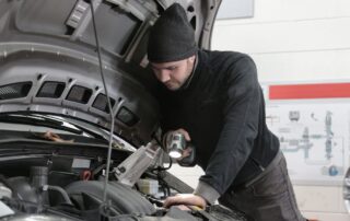 automotive technician working on a car